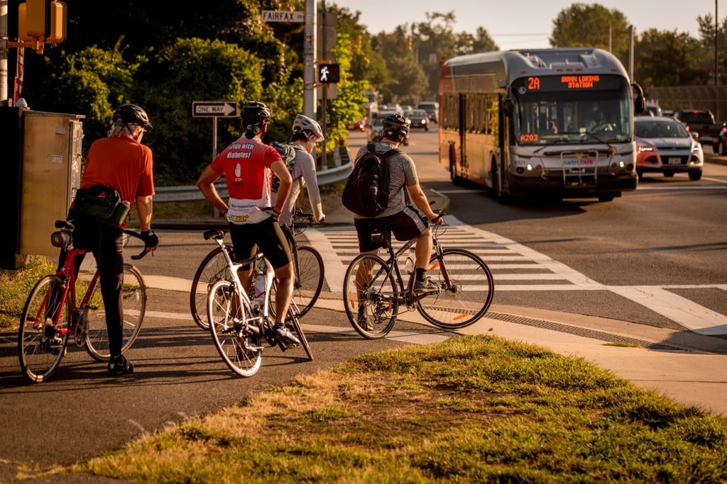 BikeCommutersWaitingBus.jpg