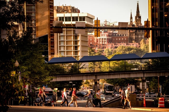 People Walking And Pedestrian Bridge