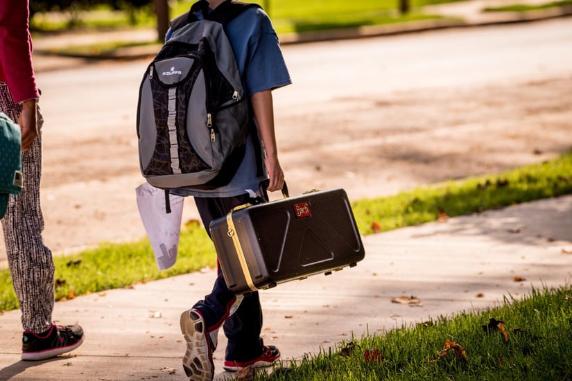 StudentWalkingWithInstrument.jpg