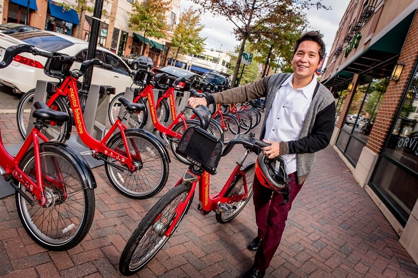 guy-with-capital-bikeshare-at-station