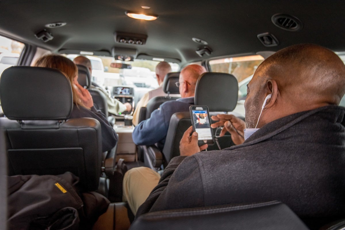 vanpool-riders-browsing-phone