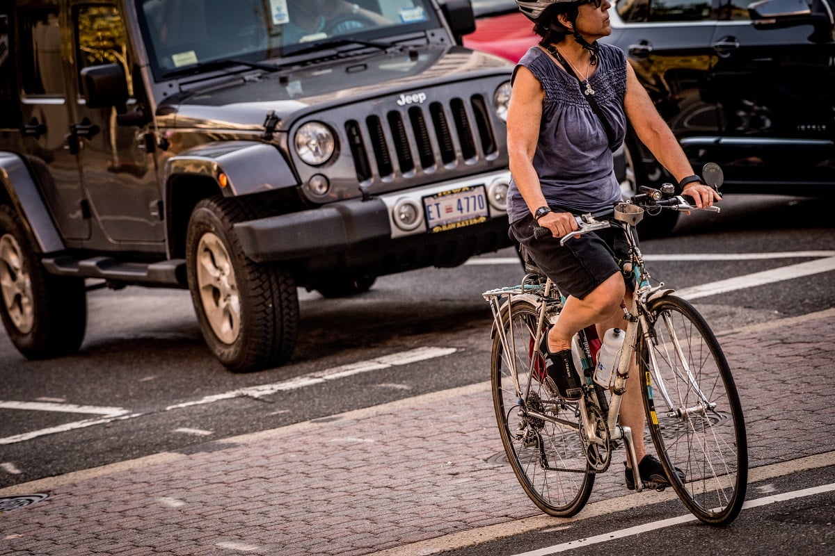 woman-biking-jeep