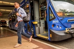 Commuter exiting bus