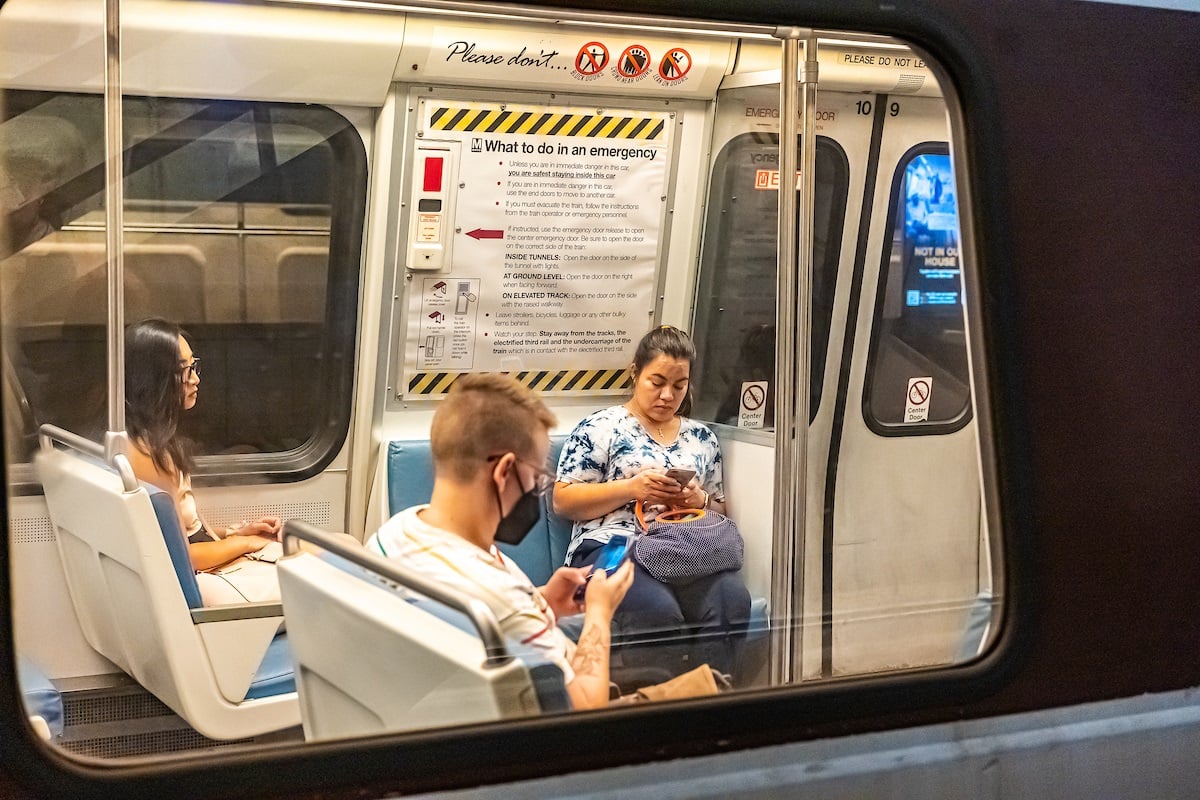 Metro-riders-on-phone