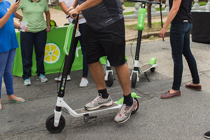 oss-2018-lime-scooter-user-kicking-off-825x551